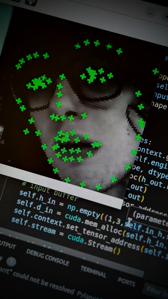 FPENet facial landmark overlay on live face with CUDA TensorRT inference code in editor